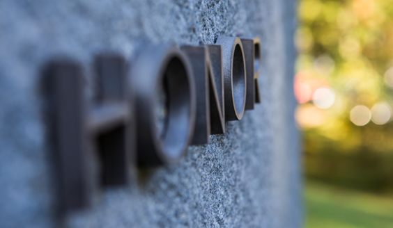 Tile in stone with the word "Honor"